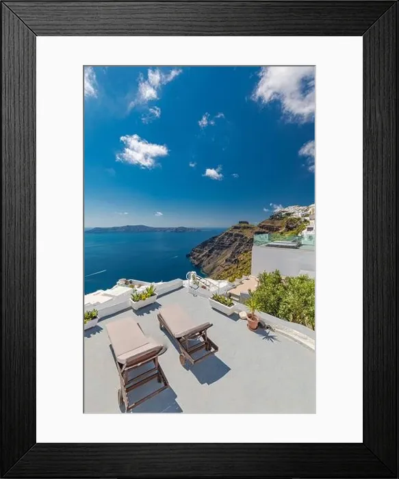 Framed Print : Beach bed chair with towel looking out over the caldera by the swimming pool, Santorini Oia. Luxury chaise lounge, amazing travel destination, summer Framed Print : Beach bed chair with towel looking out over the caldera by the swimming pool, Santorini Oia. Luxury chaise lounge, amazing travel destination, summer