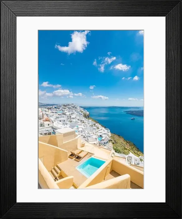 Framed Print : Beautiful white caldera view of Santorini in Greece. Luxury hotel resort pool over white architecture and sea view, blue sky. Summer travel vacation Framed Print : Beautiful white caldera view of Santorini in Greece. Luxury hotel resort pool over white architecture and sea view, blue sky. Summer travel vacation