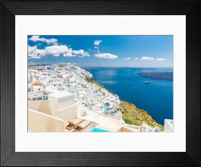 Framed Print : Beautiful white caldera view of Santorini in Greece. Luxury hotel resort pool over white architecture and sea view, blue sky. Summer travel vacation Framed Print : Beautiful white caldera view of Santorini in Greece. Luxury hotel resort pool over white architecture and sea view, blue sky. Summer travel vacation