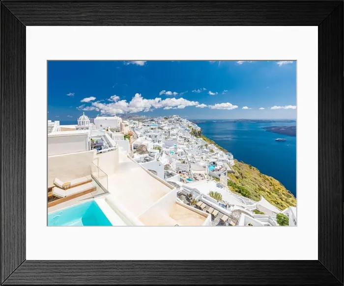 Framed Print : Beautiful white caldera view of Santorini in Greece. Luxury hotel resort pool over white architecture and sea view, blue sky. Summer travel vacation Framed Print : Beautiful white caldera view of Santorini in Greece. Luxury hotel resort pool over white architecture and sea view, blue sky. Summer travel vacation