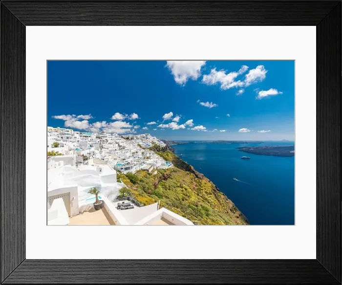 Framed Print : Beautiful white caldera view of Santorini in Greece. Luxury hotel resort pool over white architecture and sea view, blue sky. Summer travel vacation Framed Print : Beautiful white caldera view of Santorini in Greece. Luxury hotel resort pool over white architecture and sea view, blue sky. Summer travel vacation