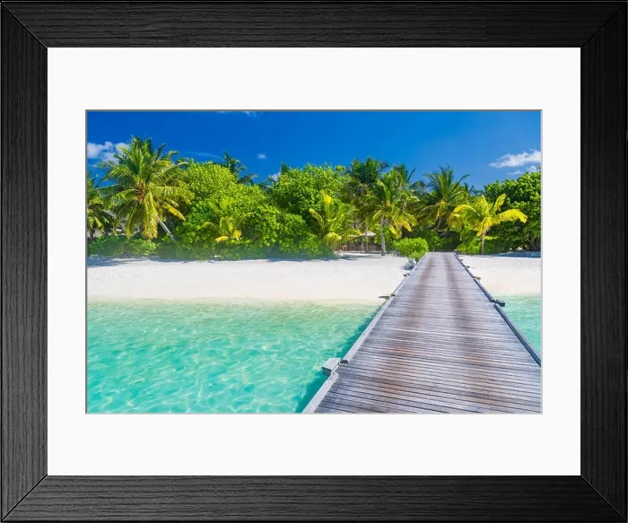 Framed Print : Fantastic beach scene in Maldives island. Palm trees and blue tree with wooden jetty. Luxury vacation and holiday destination. Exotic beach background