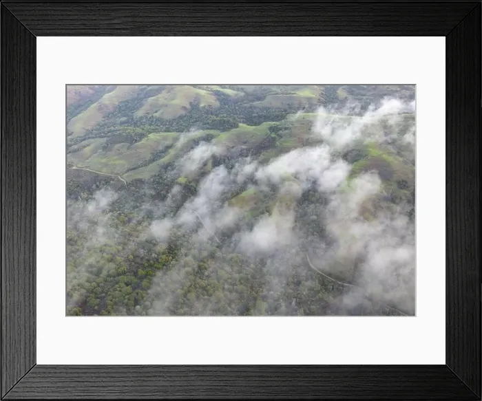 Framed Print : Low clouds drift across the rolling hills found east of San Francisco Bay, CA. This dry region turns green during the winter months due to rain
