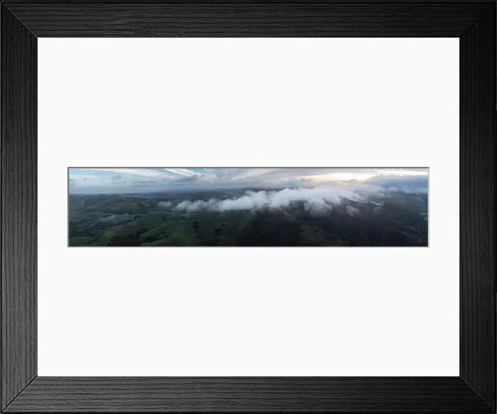 Framed Print : Low clouds drift across the rolling hills found east of San Francisco Bay, CA. This dry region turns green during the winter months due to rain Framed Print : Low clouds drift across the rolling hills found east of San Francisco Bay, CA. This dry region turns green during the winter months due to rain