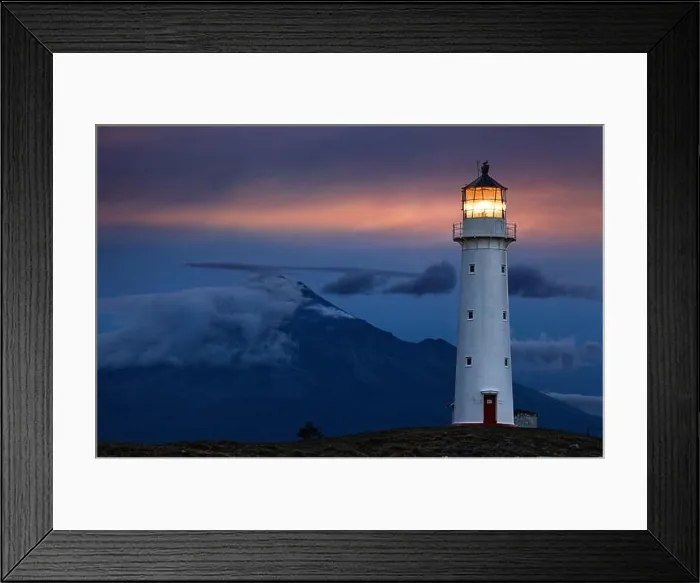 Framed Print : Cape Egmont Lighthouse and Taranaki Mount on background, New Zealand Framed Print : Cape Egmont Lighthouse and Taranaki Mount on background, New Zealand