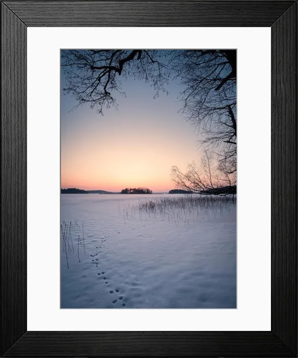 Framed Print : Scenic winter landscape with sunset and snowy lake at evening time in Finland