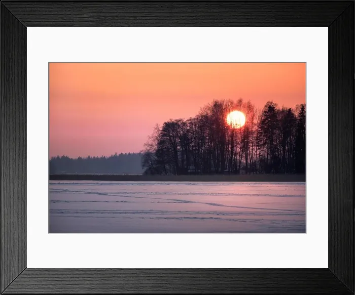 Framed Print : Scenic sunset with big sun at winter evening in Finland Framed Print : Scenic sunset with big sun at winter evening in Finland