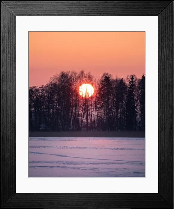 Framed Print : Scenic sunset with big sun at winter evening in Finland Framed Print : Scenic sunset with big sun at winter evening in Finland
