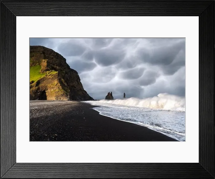 Framed Print : Incredible view on Black beach and Troll toes cliffs in cloudy weather. Stormy sky with menacing mammatus clouds on background Framed Print : Incredible view on Black beach and Troll toes cliffs in cloudy weather. Stormy sky with menacing mammatus clouds on background