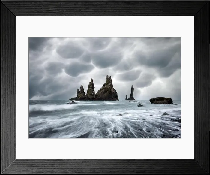 Framed Print : Basalt rock formations Troll toes on black beach with stormy sky with menacing mammatus clouds on background. Reynisdrangar, Vik, Iceland Framed Print : Basalt rock formations Troll toes on black beach with stormy sky with menacing mammatus clouds on background. Reynisdrangar, Vik, Iceland