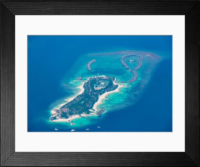 Framed Print : One of sea island located in Maldives in area Ari atoll. Luxury water villas in blue sea, amazing aerial landscape. Exotic travel destination Framed Print : One of sea island located in Maldives in area Ari atoll. Luxury water villas in blue sea, amazing aerial landscape. Exotic travel destination