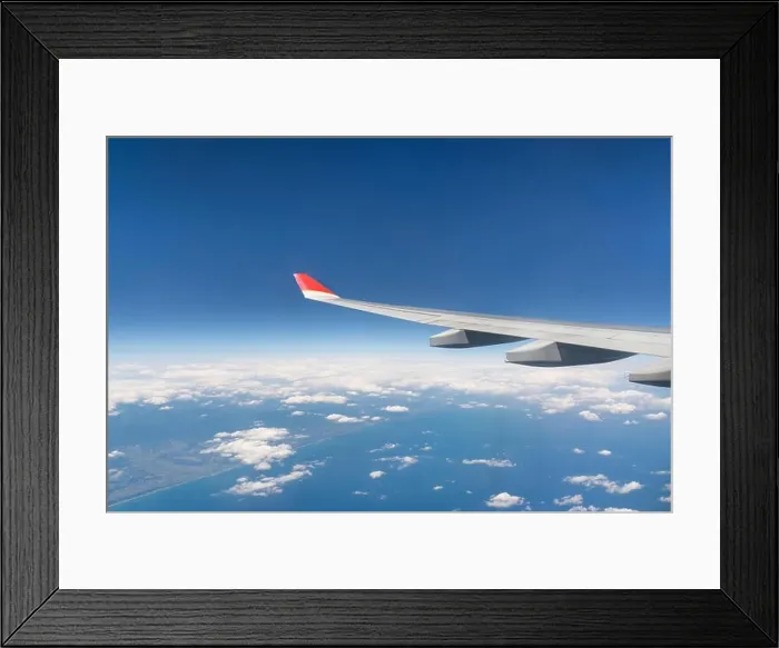 Framed Print : View from airplane window with blue sky and white clouds Framed Print : View from airplane window with blue sky and white clouds