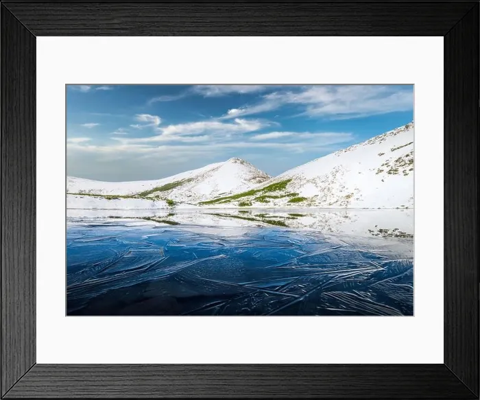 Framed Print : Frozen mountain lake with blue ice and cracks on the surface. Picturesque winter landscape with snowy hills under a blue sky, Carpathian mountains Framed Print : Frozen mountain lake with blue ice and cracks on the surface. Picturesque winter landscape with snowy hills under a blue sky, Carpathian mountains