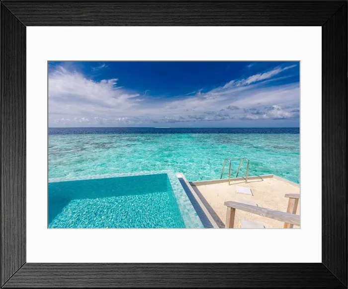 Framed Print : Infinity pool on the bright summer day. Infinity swimming pool in luxury hotel resort, tropical seascape, lagoon. Amazing summer vacation leisure view Framed Print : Infinity pool on the bright summer day. Infinity swimming pool in luxury hotel resort, tropical seascape, lagoon. Amazing summer vacation leisure view