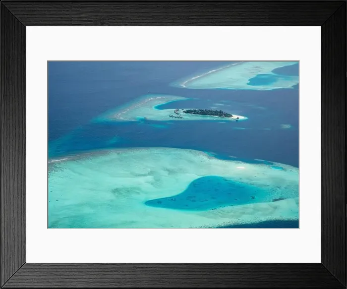 Framed Print : Amazing bird eyes view in Maldives from plane or drone. Luxury resort hotel water villas bungalows. Summer vacation holiday landscape destination Framed Print : Amazing bird eyes view in Maldives from plane or drone. Luxury resort hotel water villas bungalows. Summer vacation holiday landscape destination
