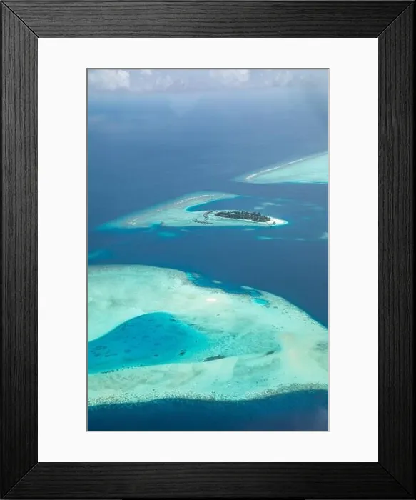 Framed Print : Amazing bird eyes view in Maldives from plane or drone. Luxury resort hotel water villas bungalows. Summer vacation holiday landscape destination Framed Print : Amazing bird eyes view in Maldives from plane or drone. Luxury resort hotel water villas bungalows. Summer vacation holiday landscape destination
