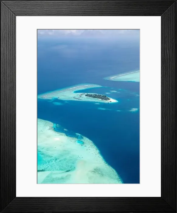 Framed Print : Amazing bird eyes view in Maldives from plane or drone. Luxury resort hotel water villas bungalows. Summer vacation holiday landscape destination Framed Print : Amazing bird eyes view in Maldives from plane or drone. Luxury resort hotel water villas bungalows. Summer vacation holiday landscape destination