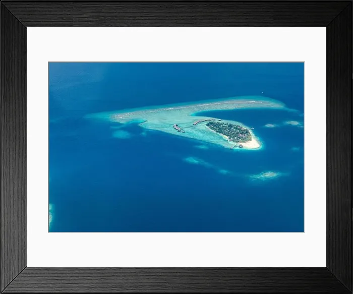 Framed Print : Amazing bird eyes view in Maldives from plane or drone. Luxury resort hotel water villas bungalows. Summer vacation holiday landscape destination Framed Print : Amazing bird eyes view in Maldives from plane or drone. Luxury resort hotel water villas bungalows. Summer vacation holiday landscape destination