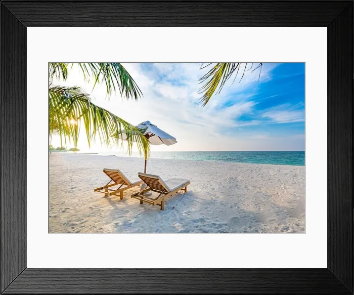 Framed Print : Tropical beach sunset background as summer landscape with lounge chairs and palm trees and calm sea for beach banner. Calm tropical beach landscape Framed Print : Tropical beach sunset background as summer landscape with lounge chairs and palm trees and calm sea for beach banner. Calm tropical beach landscape