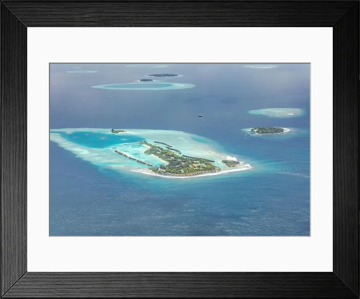 Framed Print : Amazing bird eyes view in Maldives from plane or drone. Luxury resort hotel water villas bungalows. Summer vacation holiday landscape destination Framed Print : Amazing bird eyes view in Maldives from plane or drone. Luxury resort hotel water villas bungalows. Summer vacation holiday landscape destination