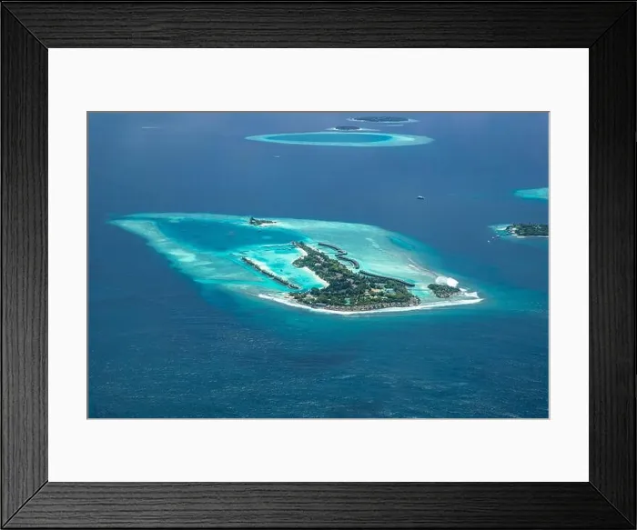 Framed Print : Amazing bird eyes view in Maldives from plane or drone. Luxury resort hotel water villas bungalows. Summer vacation holiday landscape destination