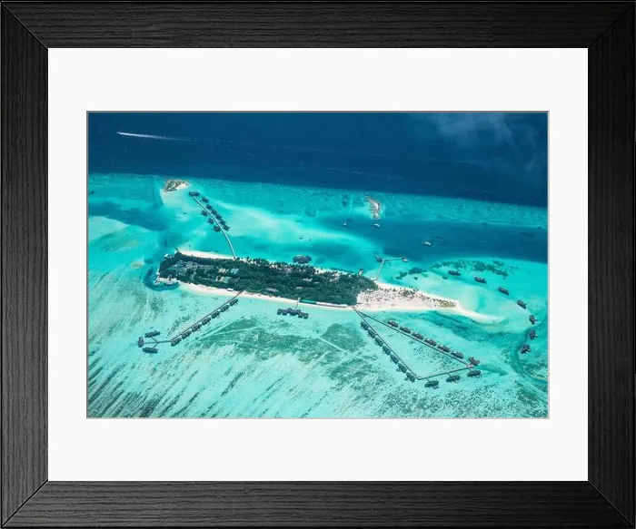 Framed Print : Amazing bird eyes view in Maldives from plane or drone. Luxury resort hotel water villas bungalows. Summer vacation holiday landscape destination Framed Print : Amazing bird eyes view in Maldives from plane or drone. Luxury resort hotel water villas bungalows. Summer vacation holiday landscape destination