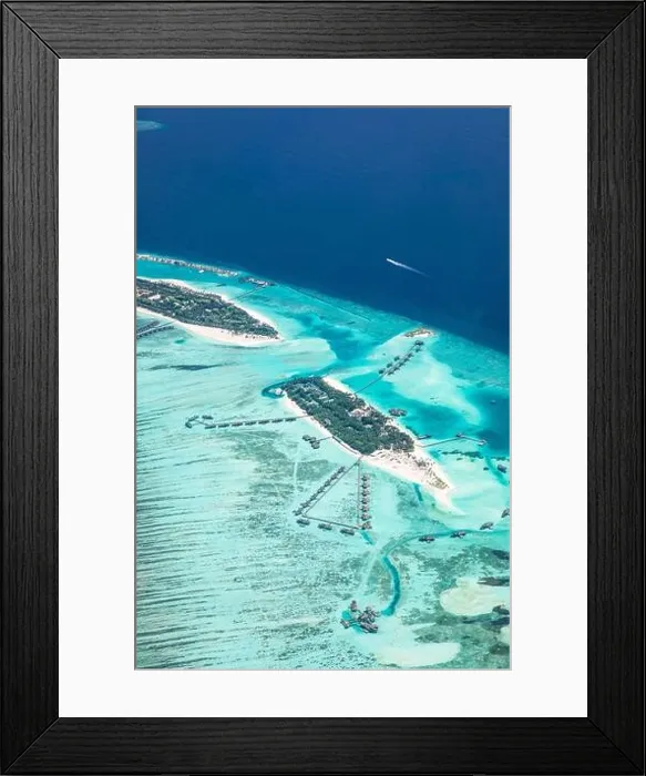 Framed Print : Amazing bird eyes view in Maldives from plane or drone. Luxury resort hotel water villas bungalows. Summer vacation holiday landscape destination
