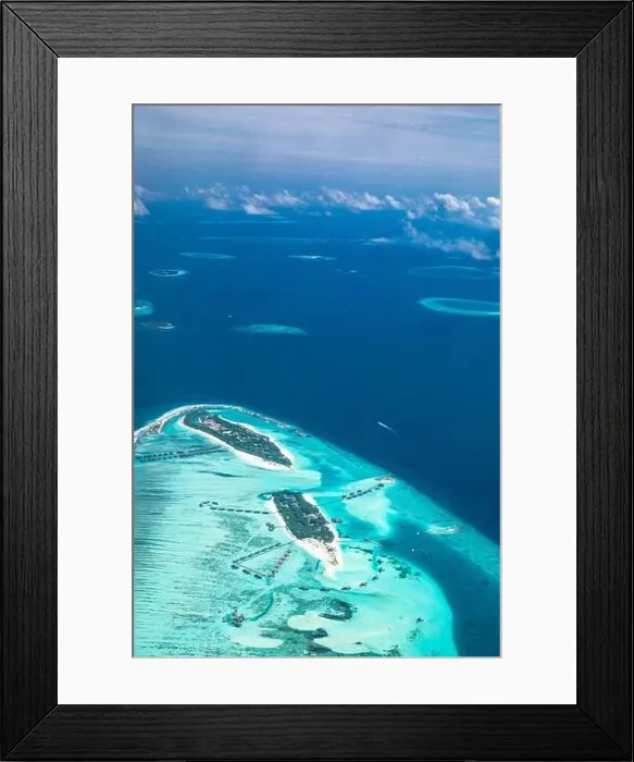 Framed Print : Amazing bird eyes view in Maldives from plane or drone. Luxury resort hotel water villas bungalows. Summer vacation holiday landscape destination Framed Print : Amazing bird eyes view in Maldives from plane or drone. Luxury resort hotel water villas bungalows. Summer vacation holiday landscape destination