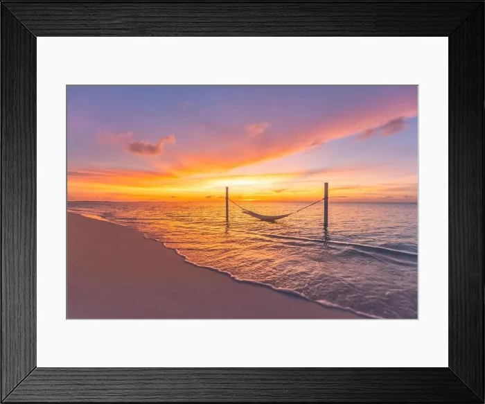 Framed Print : Tropical sunset beach background as summer landscape panorama with beach swing hammock and white sand and calm sea beach banner. Perfect beach scene Framed Print : Tropical sunset beach background as summer landscape panorama with beach swing hammock and white sand and calm sea beach banner. Perfect beach scene