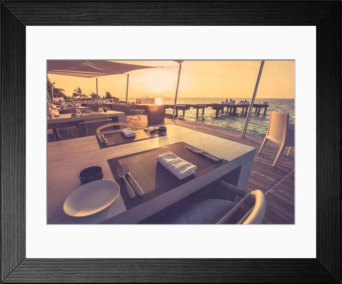 Framed Print : Table dinner setting at the beach on twilight time in tropical shoreline, relaxing mood Framed Print : Table dinner setting at the beach on twilight time in tropical shoreline, relaxing mood