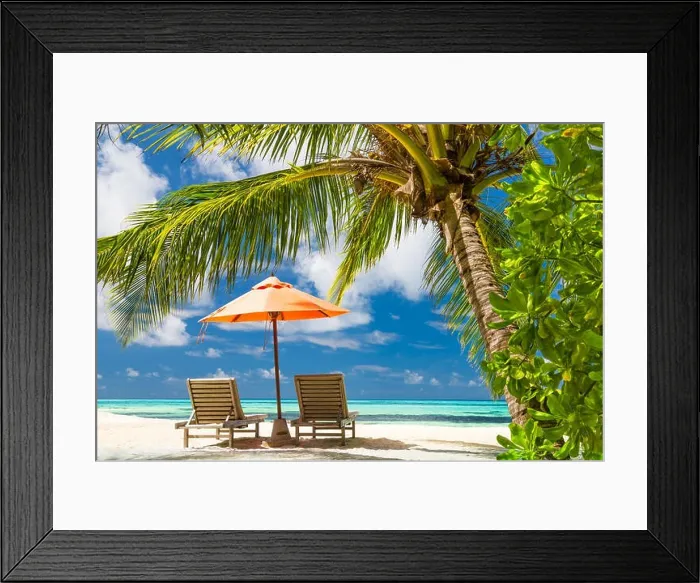 Framed Print : Perfect beach banner, two sun chairs and umbrella in tropical landscape. Tranquil exotic nature scenery. Luxury resort for summer vacation and holiday Framed Print : Perfect beach banner, two sun chairs and umbrella in tropical landscape. Tranquil exotic nature scenery. Luxury resort for summer vacation and holiday