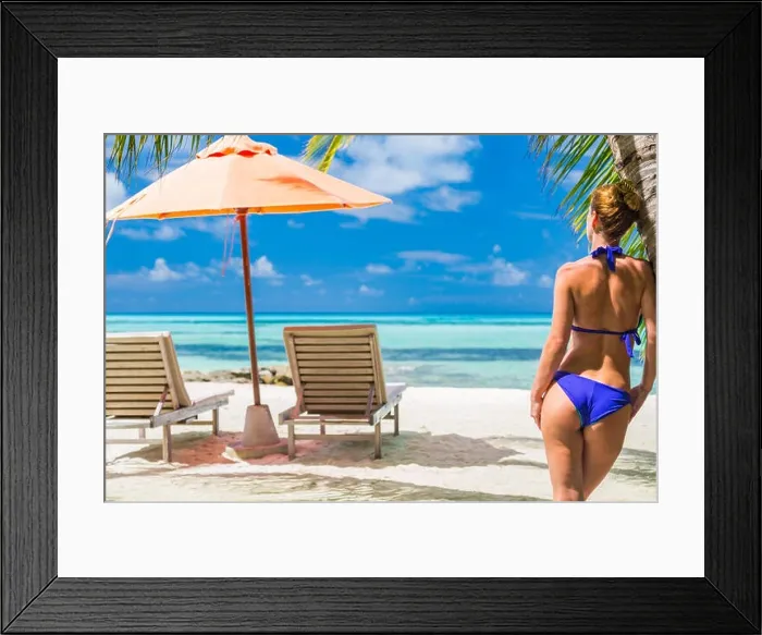 Framed Print : Sexy woman at peace in blue bikini on tropical beach under palm trees Framed Print : Sexy woman at peace in blue bikini on tropical beach under palm trees
