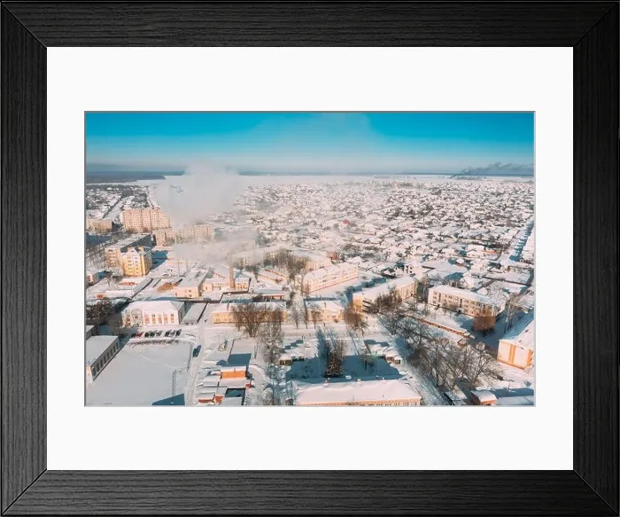 Framed Print : Dobrush, Gomel Region, Belarus. Aerial View Of Skyline Cityscape In Sunny Winter Day. Snowy Landscape Cityscape Skyline Framed Print : Dobrush, Gomel Region, Belarus. Aerial View Of Skyline Cityscape In Sunny Winter Day. Snowy Landscape Cityscape Skyline