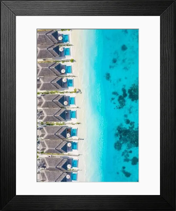Framed Print : Atolls and islands in Maldives. Tropical island at Maldives with luxury water villas, bungalows over amazing blue sea. Summer vacation, aerial view Framed Print : Atolls and islands in Maldives. Tropical island at Maldives with luxury water villas, bungalows over amazing blue sea. Summer vacation, aerial view