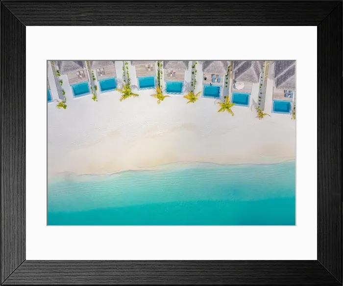 Framed Print : Atolls and islands in Maldives. Tropical island at Maldives with luxury water villas, bungalows over amazing blue sea. Summer vacation, aerial view Framed Print : Atolls and islands in Maldives. Tropical island at Maldives with luxury water villas, bungalows over amazing blue sea. Summer vacation, aerial view