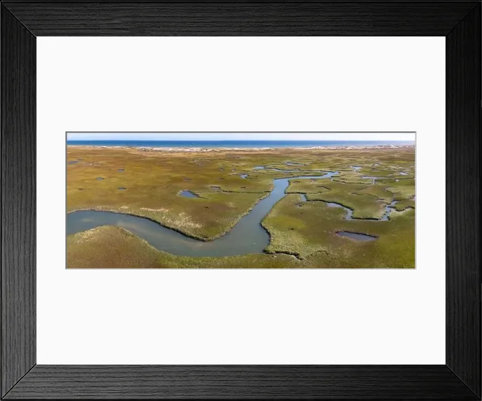 Framed Print : Narrow channels meander through a salt marsh in Pleasant Bay, Cape Cod, Massachusetts. This wetland habitat is vital feeding grounds for wildlife Framed Print : Narrow channels meander through a salt marsh in Pleasant Bay, Cape Cod, Massachusetts. This wetland habitat is vital feeding grounds for wildlife