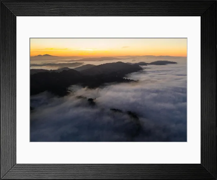 Framed Print : The marine layer, a moist air mass that develops over the ocean in the presence of a temperature inversion, seeps over the Bay Area in California Framed Print : The marine layer, a moist air mass that develops over the ocean in the presence of a temperature inversion, seeps over the Bay Area in California
