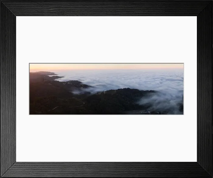Framed Print : The marine layer, a moist air mass that develops over the ocean in the presence of a temperature inversion, seeps over the Bay Area in California Framed Print : The marine layer, a moist air mass that develops over the ocean in the presence of a temperature inversion, seeps over the Bay Area in California
