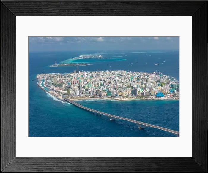Framed Print : Island Of Male, The Capital of Maldives from the sky. Bridge connecting with the airport island. Maldives island, cityscape, exotic travel destination Framed Print : Island Of Male, The Capital of Maldives from the sky. Bridge connecting with the airport island. Maldives island, cityscape, exotic travel destination