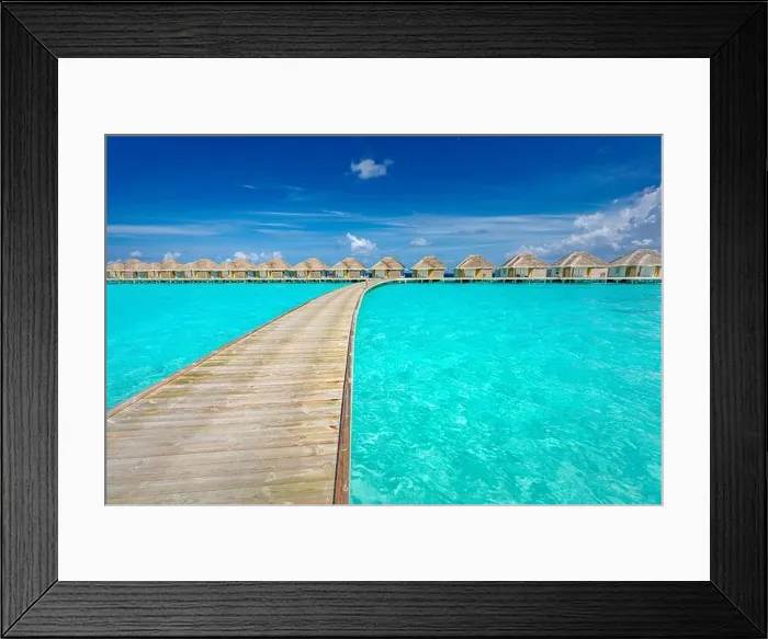 Framed Print : Tropical Maldives island with coconut palm tree, wooden bridge and water villa. Exotic travel landscape. Beautiful summer island paradise, peaceful Framed Print : Tropical Maldives island with coconut palm tree, wooden bridge and water villa. Exotic travel landscape. Beautiful summer island paradise, peaceful