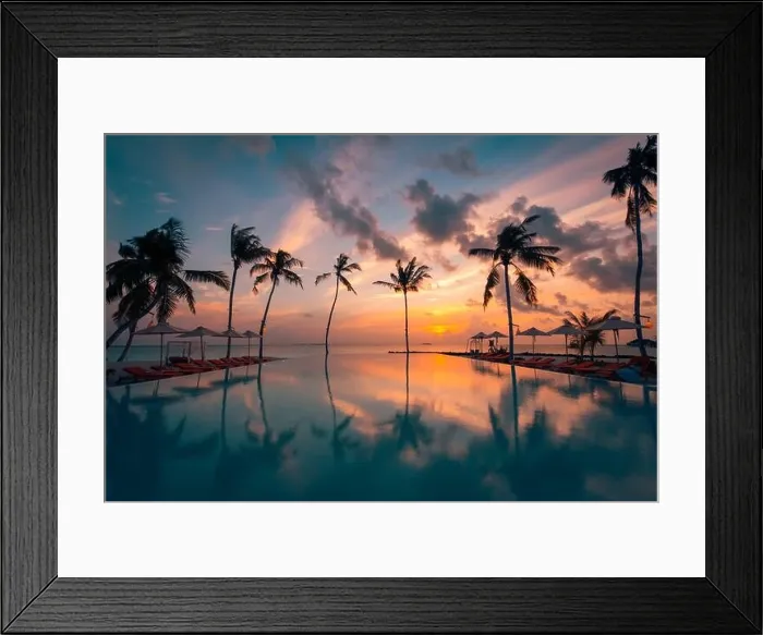 Framed Print : Luxury resort beach. Beautiful poolside and sunset sky. Luxurious tropical beach landscape, deck chairs and loungers infinity pool water reflection Framed Print : Luxury resort beach. Beautiful poolside and sunset sky. Luxurious tropical beach landscape, deck chairs and loungers infinity pool water reflection