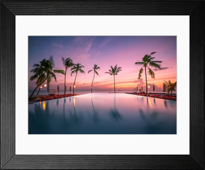 Framed Print : Luxury resort beach. Beautiful poolside and sunset sky. Luxurious tropical beach landscape, deck chairs and loungers infinity pool water reflection Framed Print : Luxury resort beach. Beautiful poolside and sunset sky. Luxurious tropical beach landscape, deck chairs and loungers infinity pool water reflection