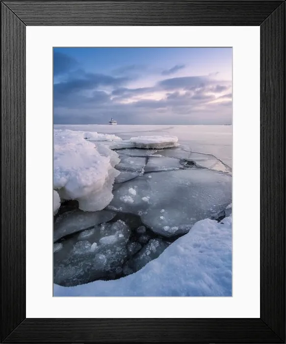 Framed Print : Scenic winter landscape with cruise and sunset at cold evening in Helsinki, Finland Framed Print : Scenic winter landscape with cruise and sunset at cold evening in Helsinki, Finland