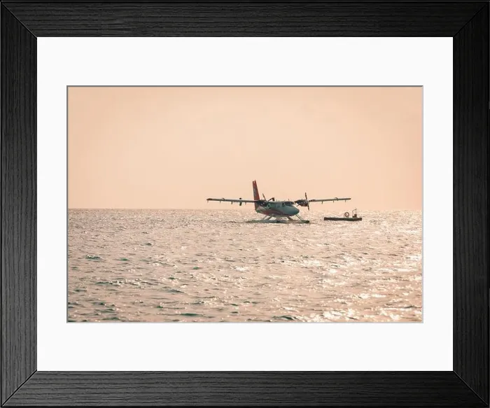 Framed Print : 05.06.2019 - Ari Atoll, Maldives: Exotic scene with seaplane on Maldives sea landing. Vacation holiday in Maldives concept background. Seaplane taxi Framed Print : 05.06.2019 - Ari Atoll, Maldives: Exotic scene with seaplane on Maldives sea landing. Vacation holiday in Maldives concept background. Seaplane taxi