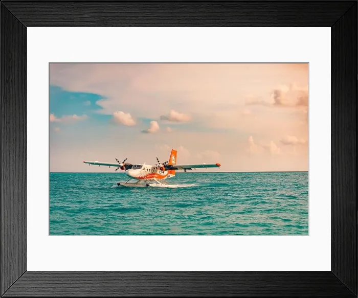Framed Print : 05.06.2019 - Ari Atoll, Maldives: Exotic scene with seaplane on Maldives sea landing. Vacation holiday in Maldives concept background. Seaplane taxi Framed Print : 05.06.2019 - Ari Atoll, Maldives: Exotic scene with seaplane on Maldives sea landing. Vacation holiday in Maldives concept background. Seaplane taxi