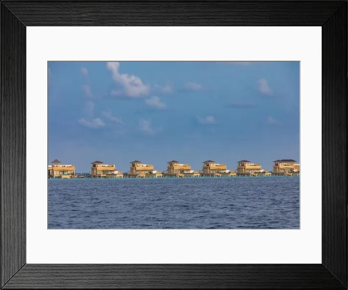 Framed Print : Overwater bungalows at Maldives island. Luxury summer travel vacation destination. Exotic island, sea lagoon, water villas Framed Print : Overwater bungalows at Maldives island. Luxury summer travel vacation destination. Exotic island, sea lagoon, water villas