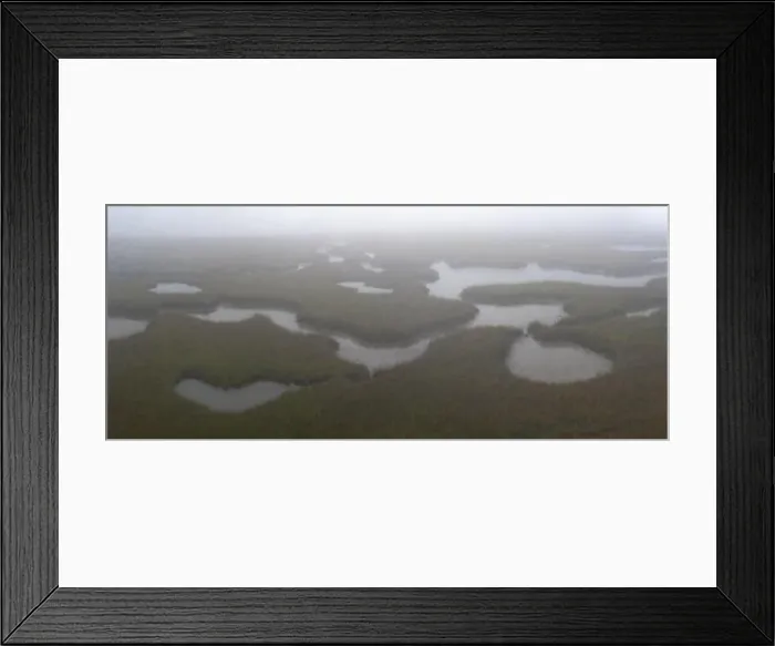Framed Print : Channels meander through a foggy salt marsh in Pleasant Bay, Cape Cod, Massachusetts. This wetland habitat is vital feeding grounds for wildlife Framed Print : Channels meander through a foggy salt marsh in Pleasant Bay, Cape Cod, Massachusetts. This wetland habitat is vital feeding grounds for wildlife