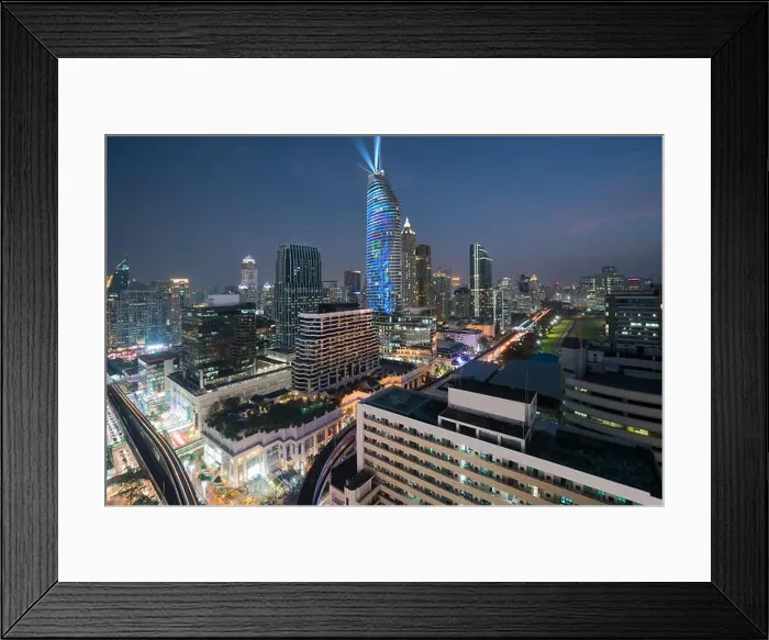 Framed Print : Night view with skyscraper in business district in Bangkok Thailand. Light show at Magnolias Ratchaprasong in Bangkok, Thailand Framed Print : Night view with skyscraper in business district in Bangkok Thailand. Light show at Magnolias Ratchaprasong in Bangkok, Thailand