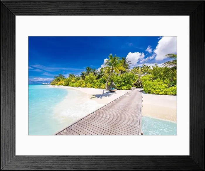 Framed Print : Beautiful tropical Maldives island with beach sea and coconut palm tree on blue sky for nature holiday vacation. Long jetty into paradise Framed Print : Beautiful tropical Maldives island with beach sea and coconut palm tree on blue sky for nature holiday vacation. Long jetty into paradise