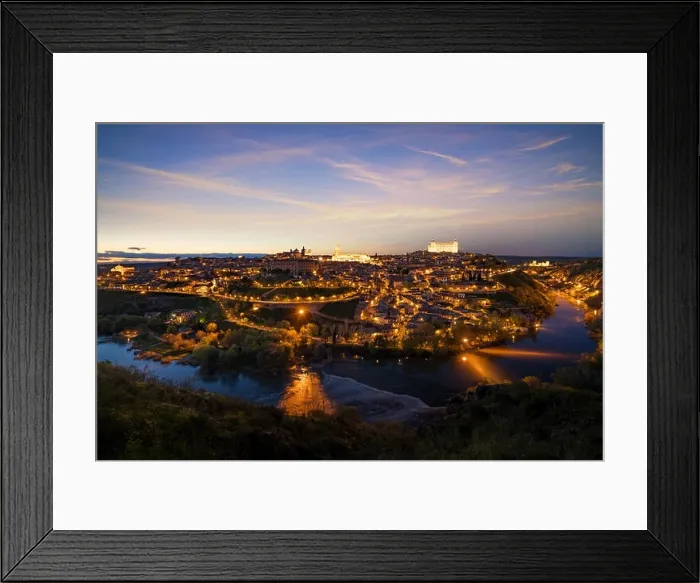Framed Print : Panoramic view of the medieval center of the city of Toledo, Spain. It features the Tejo river, the Cathedral and Alcazar of Toledo, Spain Framed Print : Panoramic view of the medieval center of the city of Toledo, Spain. It features the Tejo river, the Cathedral and Alcazar of Toledo, Spain